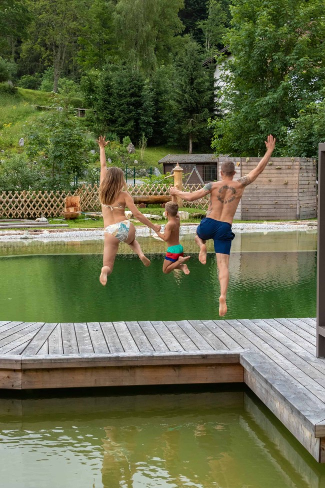 Jumping into the swimming pond with the whole family