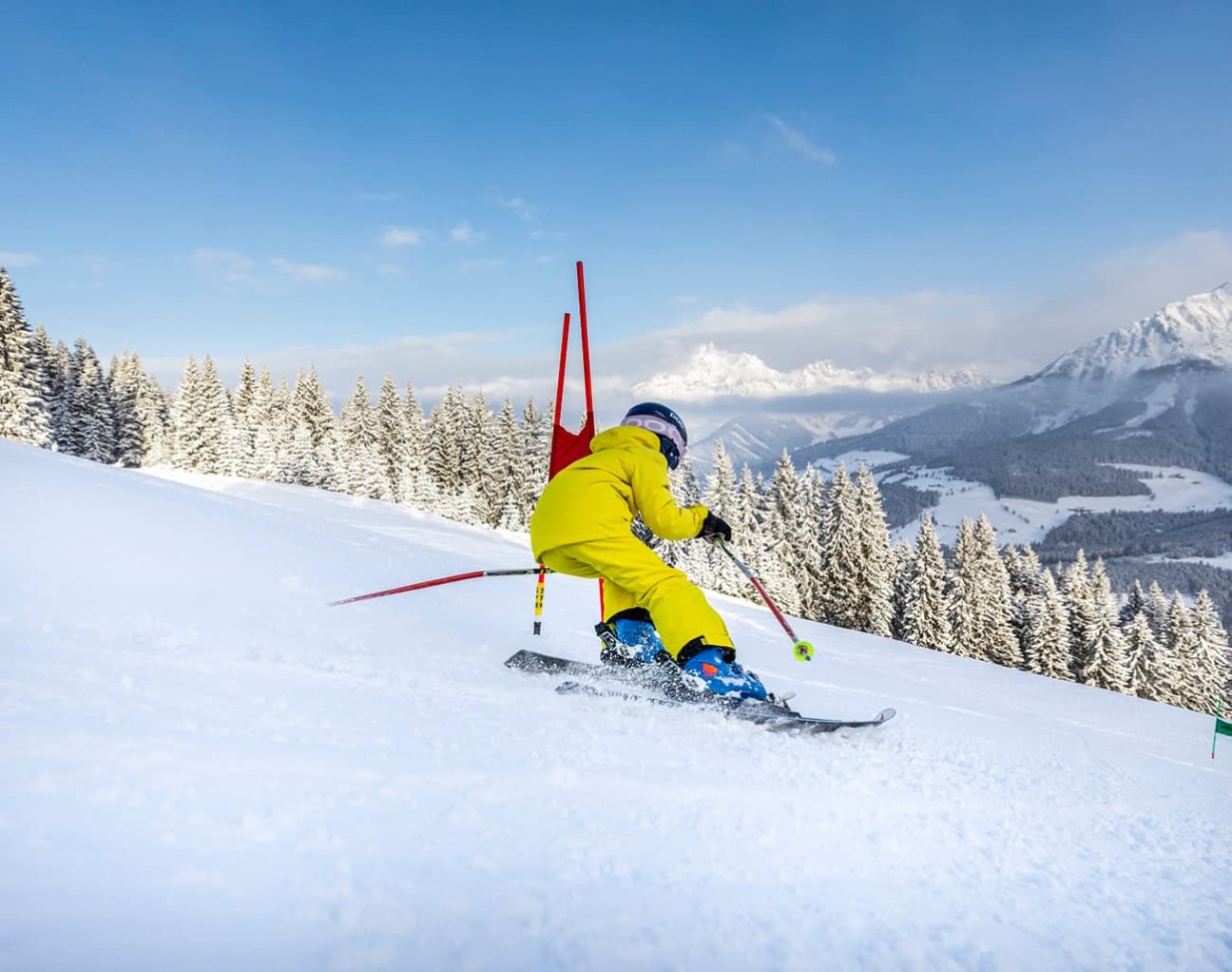 Child skiing on a ski race track
