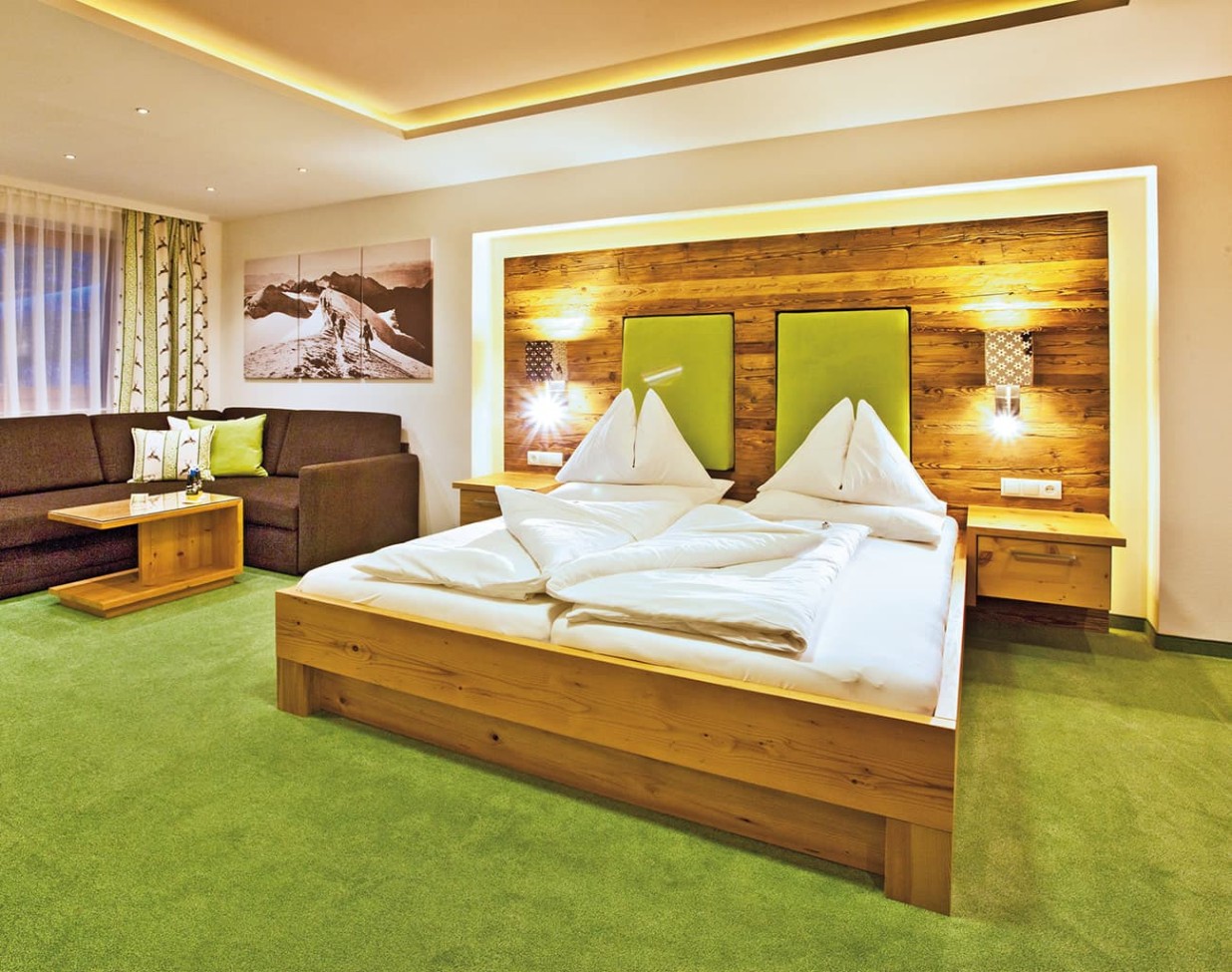 Doppelbett im Hotel Alpenhof Naturglück in Filzmoos